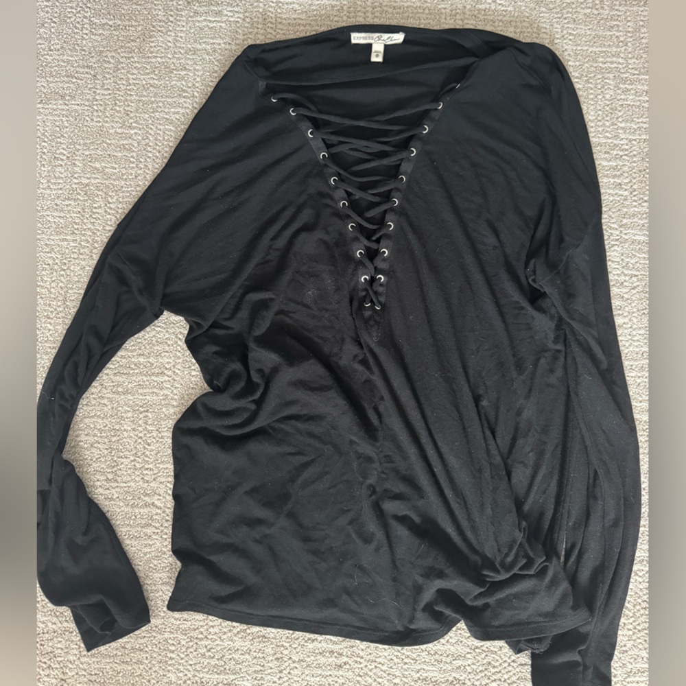 Express One Eleven. Black Long Sleeve shirt with cross cross straps in the front